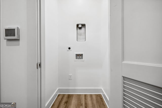 112 Rogers St NE Unit 304, Atlanta, GA 30317 - washroom featuring hookup for an electric dryer, washer hookup, dark wood finished floors, and baseboards