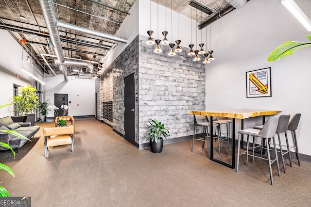 112 Rogers St NE Unit 304, Atlanta, GA 30317 - dining room featuring a high ceiling, a fireplace, and baseboards