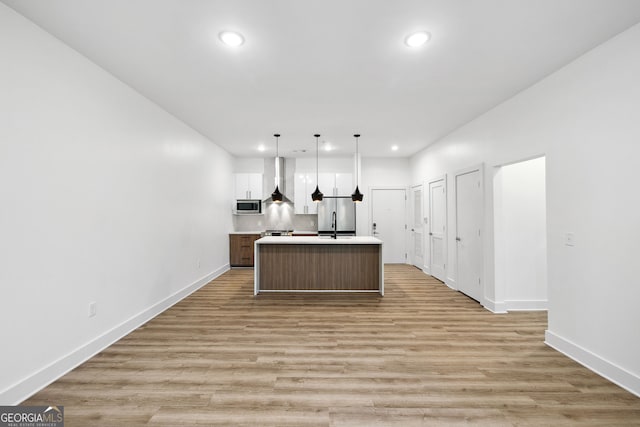 112 Rogers St NE Unit 304, Atlanta, GA 30317 - kitchen with appliances with stainless steel finishes, recessed lighting, baseboards, a center island, and light countertops