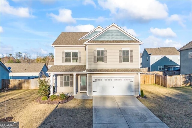 303 Orange Cir, Dawsonville, GA 30534 - view of front of house featuring driveway, an attached garage, a porch, and roof with shingles