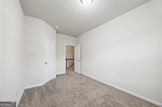 303 Orange Cir, Dawsonville, GA 30534 - unfurnished bedroom featuring carpet and baseboards