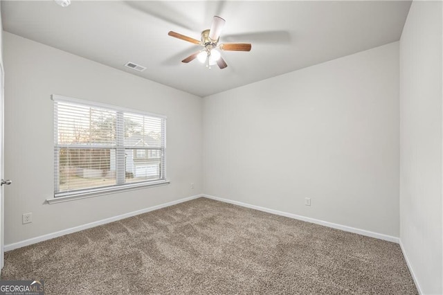 303 Orange Cir, Dawsonville, GA 30534 - carpeted spare room with a ceiling fan and baseboards