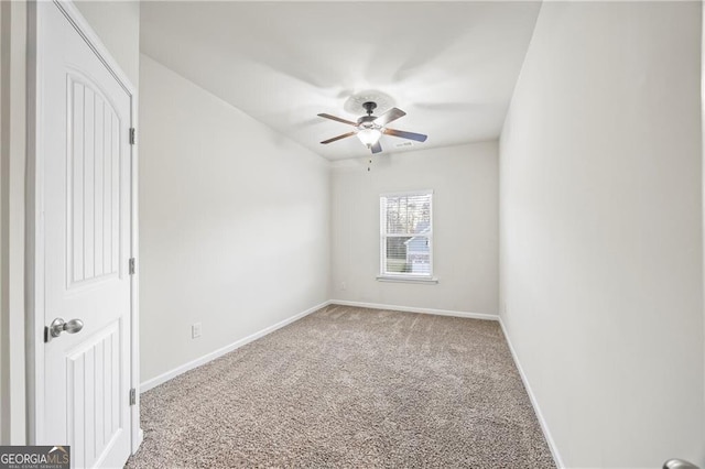 303 Orange Cir, Dawsonville, GA 30534 - empty room featuring carpet flooring, ceiling fan, and baseboards