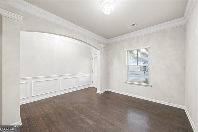 303 Orange Cir, Dawsonville, GA 30534 - spare room with hardwood / wood-style floors, arched walkways, crown molding, and a wainscoted wall