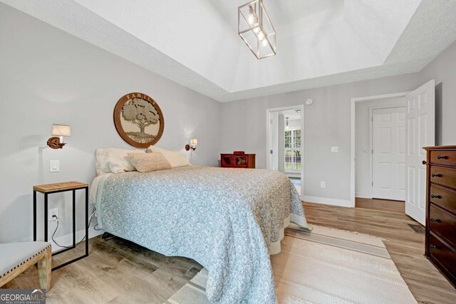 5421 Amherst Way, Flowery Branch, GA 30542 - bedroom featuring light wood-type flooring and baseboards