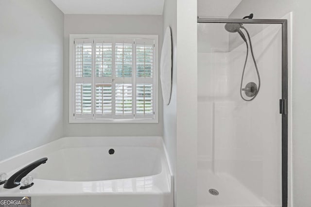 5421 Amherst Way, Flowery Branch, GA 30542 - full bath featuring plenty of natural light, a shower stall, and a garden tub