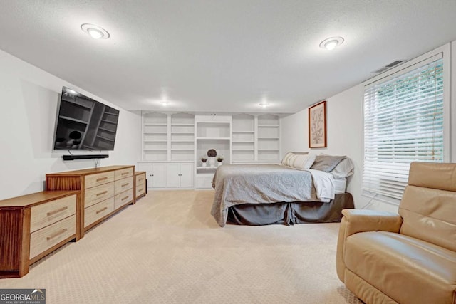 5421 Amherst Way, Flowery Branch, GA 30542 - bedroom featuring light carpet and a textured ceiling