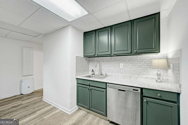 5421 Amherst Way, Flowery Branch, GA 30542 - kitchen with green cabinetry, dishwasher, a sink, light wood-style floors, and decorative backsplash