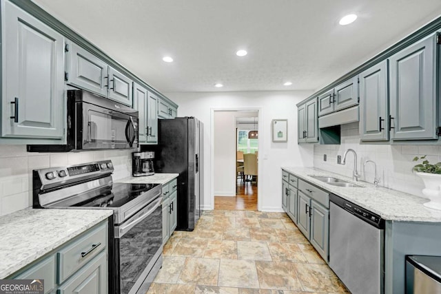 5421 Amherst Way, Flowery Branch, GA 30542 - kitchen featuring appliances with stainless steel finishes, a sink, backsplash, recessed lighting, and baseboards