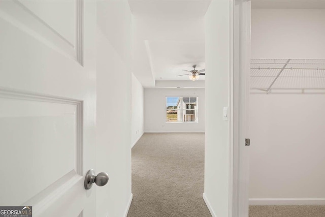 12085 Conrad Cir, Hampton, GA 30228 - hallway featuring carpet floors and baseboards
