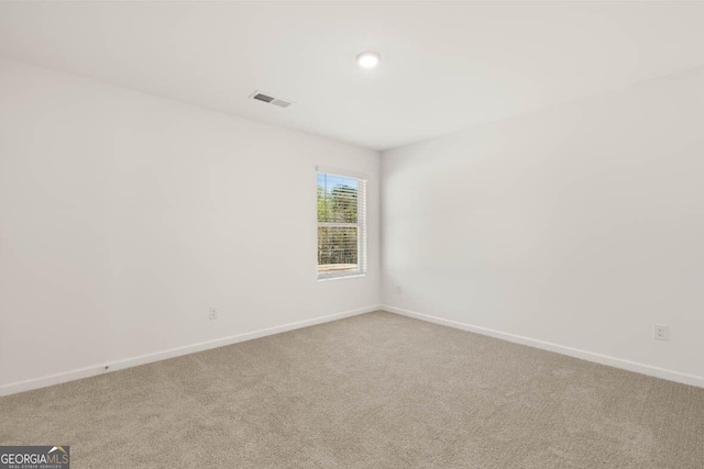 12085 Conrad Cir, Hampton, GA 30228 - carpeted spare room with baseboards