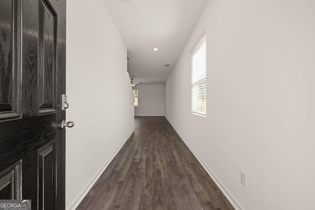 12085 Conrad Cir, Hampton, GA 30228 - corridor featuring dark wood-style flooring and recessed lighting