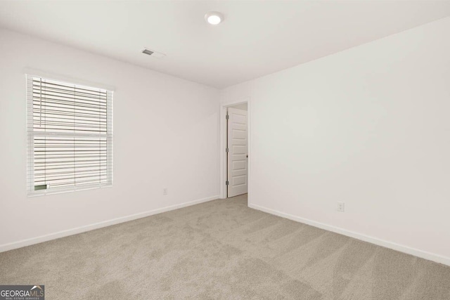 12085 Conrad Cir, Hampton, GA 30228 - carpeted empty room with baseboards