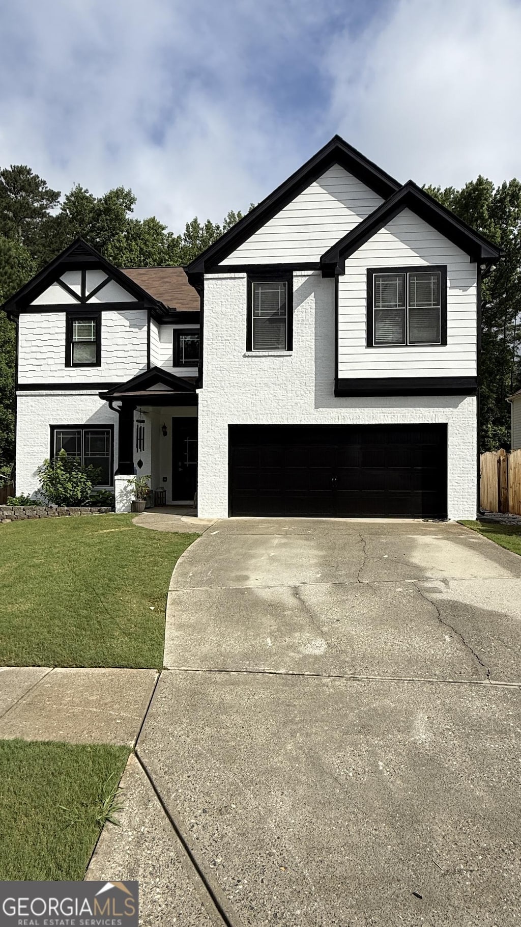 2111 Nelms Pointe Lndg, Lawrenceville, GA 30043 - view of front of property featuring an attached garage and concrete driveway