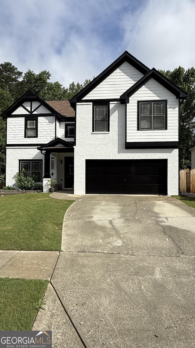2111 Nelms Pointe Lndg, Lawrenceville, GA 30043 - view of front of property featuring an attached garage and concrete driveway
