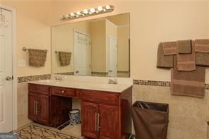 1405 Overland Xing, Alpharetta, GA 30004 - bathroom featuring double vanity, tile walls, and wainscoting