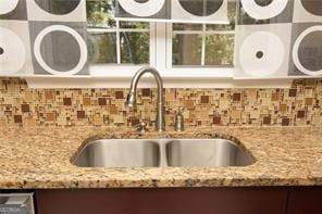 1405 Overland Xing, Alpharetta, GA 30004 - kitchen view of a sink, light stone counters, and tasteful backsplash
