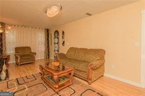1405 Overland Xing, Alpharetta, GA 30004 - living room with wood finished floors and baseboards