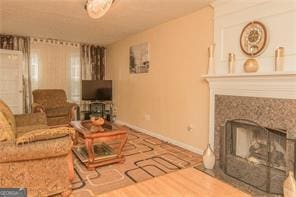 1405 Overland Xing, Alpharetta, GA 30004 - living room with a high end fireplace, baseboards, and wood finished floors