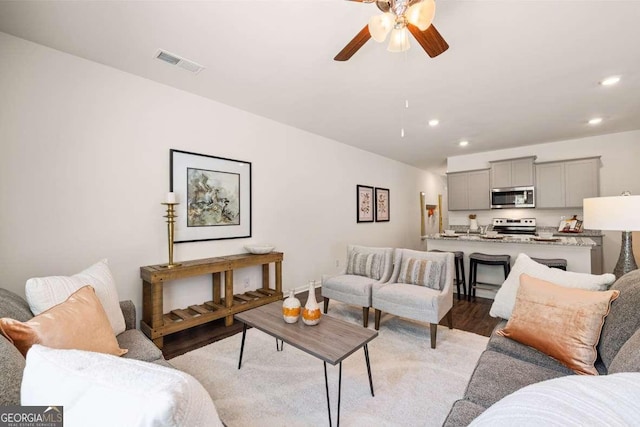 1311 Aura Ln, Lawrenceville, GA 30045 - living area featuring a ceiling fan, recessed lighting, and light wood-style floors