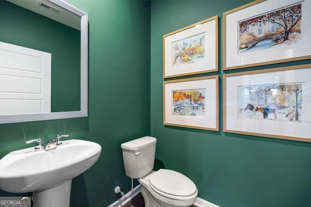 1311 Aura Ln, Lawrenceville, GA 30045 - bathroom featuring baseboards and toilet