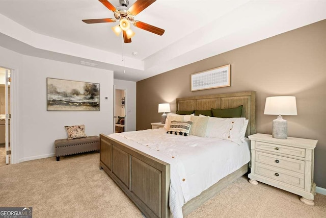 1311 Aura Ln, Lawrenceville, GA 30045 - bedroom with light carpet, a raised ceiling, and ceiling fan