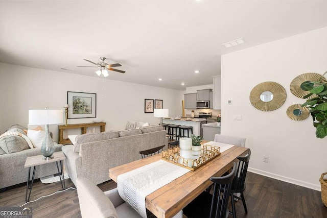 1311 Aura Ln, Lawrenceville, GA 30045 - dining area featuring dark wood finished floors, a ceiling fan, and recessed lighting