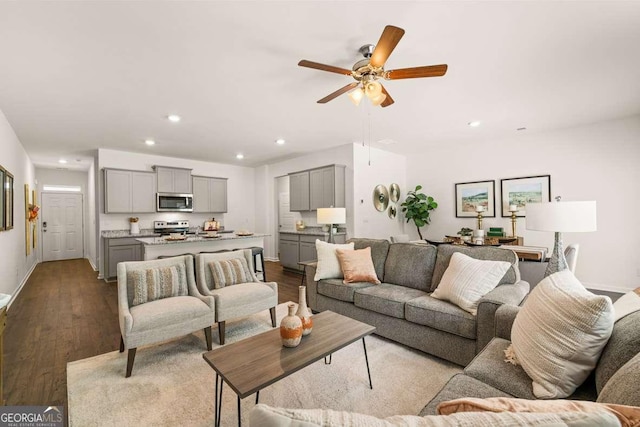 1311 Aura Ln, Lawrenceville, GA 30045 - living room featuring dark wood-style flooring, recessed lighting, and a ceiling fan