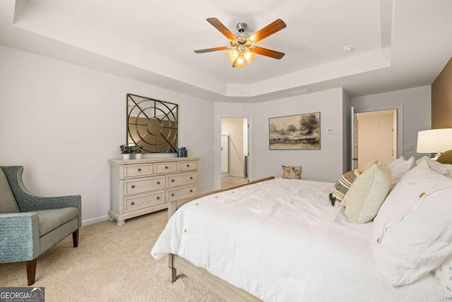 1311 Aura Ln, Lawrenceville, GA 30045 - bedroom with a raised ceiling, light colored carpet, and a ceiling fan