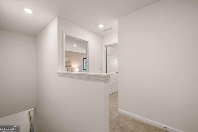 1311 Aura Ln, Lawrenceville, GA 30045 - corridor with light colored carpet, an upstairs landing, and recessed lighting