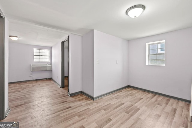 2110 Newnan St, Atlanta, GA 30344 - empty room with light wood-style flooring and healthy amount of natural light