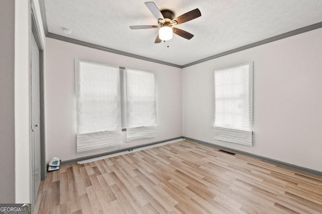 2110 Newnan St, Atlanta, GA 30344 - unfurnished room with ornamental molding, healthy amount of natural light, wood finished floors, ceiling fan, and a smoke detector