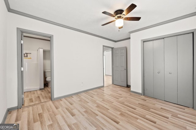 2110 Newnan St, Atlanta, GA 30344 - unfurnished bedroom featuring ornamental molding, light wood-style floors, a closet, connected bathroom, and ceiling fan