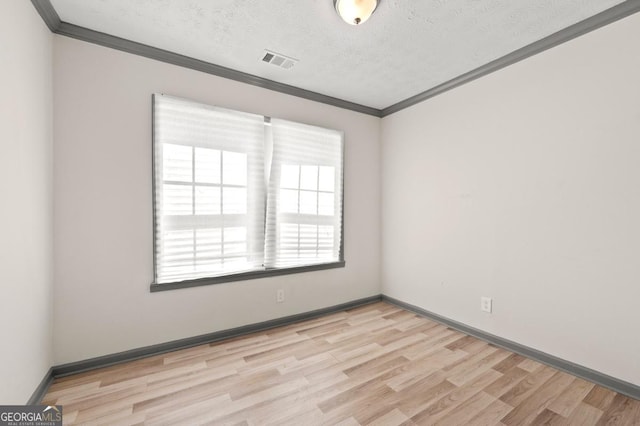 2110 Newnan St, Atlanta, GA 30344 - spare room with crown molding, light wood-type flooring, and a textured ceiling