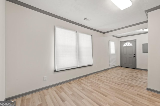 2110 Newnan St, Atlanta, GA 30344 - entrance foyer featuring light wood-style flooring, ornamental molding, and electric panel