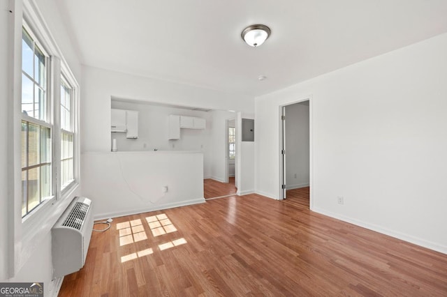 2110 Newnan St, Atlanta, GA 30344 - unfurnished living room featuring healthy amount of natural light, electric panel, and wood finished floors