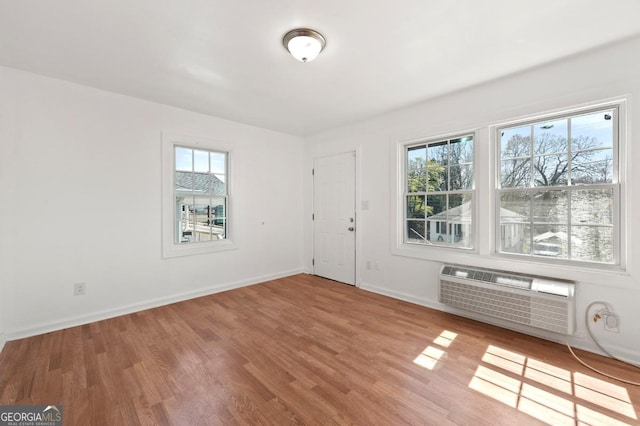 2110 Newnan St, Atlanta, GA 30344 - entrance foyer with plenty of natural light, wood finished floors, and an AC wall unit