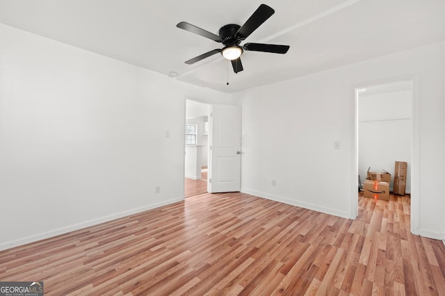 2110 Newnan St, Atlanta, GA 30344 - empty room with light wood-style floors and ceiling fan