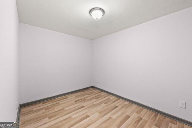 2110 Newnan St, Atlanta, GA 30344 - unfurnished room with light wood-type flooring and baseboards