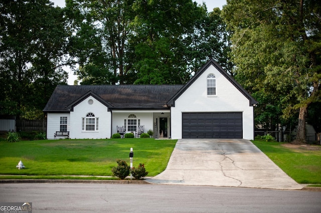 1612 Cagle Ct, Lawrenceville, GA 30045 - view of front facade with concrete driveway and an attached garage