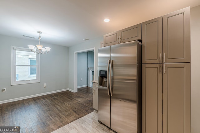 489 Radar Dr, Hapeville, GA 30354 - kitchen featuring stainless steel refrigerator with ice dispenser, a chandelier, baseboards, light wood-style floors, and recessed lighting