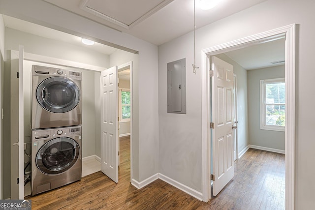 489 Radar Dr, Hapeville, GA 30354 - laundry room featuring electric panel, stacked washer / drying machine, wood finished floors, and baseboards