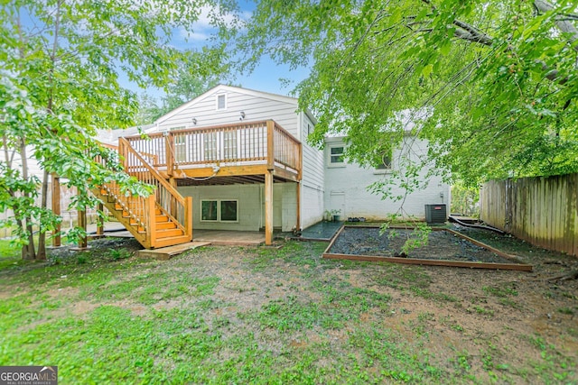489 Radar Dr, Hapeville, GA 30354 - back of house featuring a vegetable garden, a deck, central AC unit, and stairs