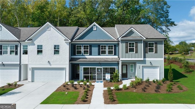 168 Jaxton St Unit 77, Hoschton, GA 30548 - townhome / multi-family property featuring an attached garage, concrete driveway, and a front yard
