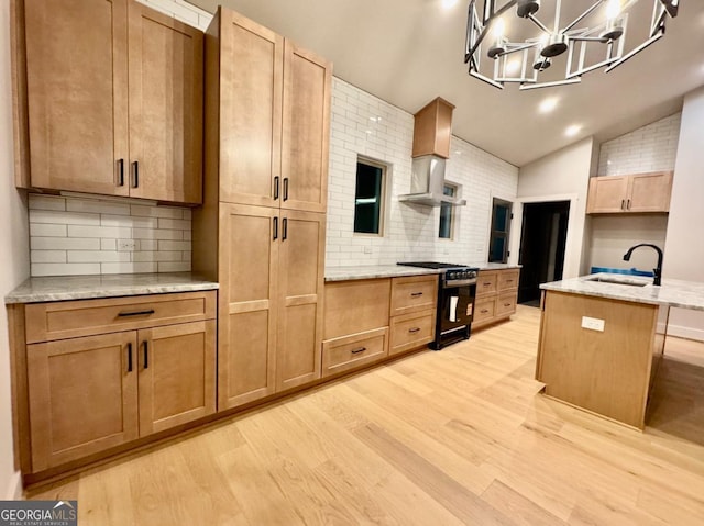 54 Myna, Ellijay, GA 30540 - kitchen featuring gas range oven, light wood-type flooring, decorative backsplash, light stone counters, and vaulted ceiling