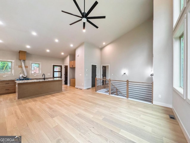 54 Myna, Ellijay, GA 30540 - unfurnished living room with light wood-style floors, a ceiling fan, high vaulted ceiling, and recessed lighting