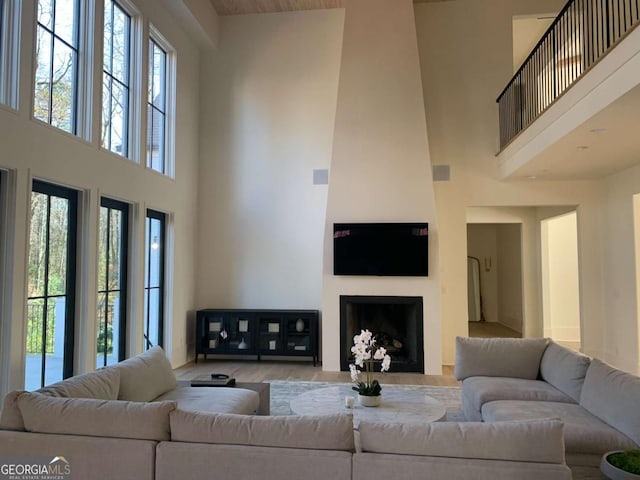 1303 Cobblemill Way NW, Kennesaw, GA 30152 - living room featuring a high ceiling and a fireplace