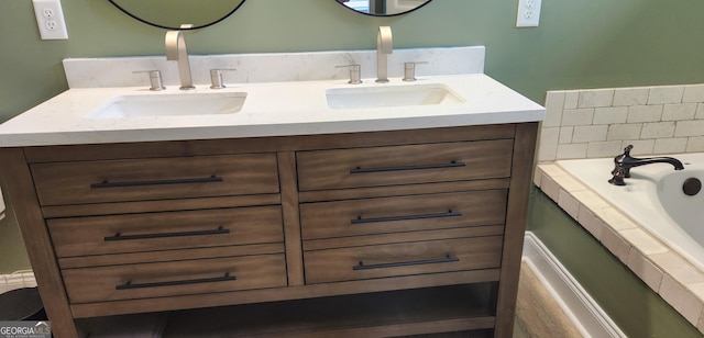 556 Constitution Dr, Forsyth, GA 31029 - full bathroom featuring double vanity and a relaxing tiled tub