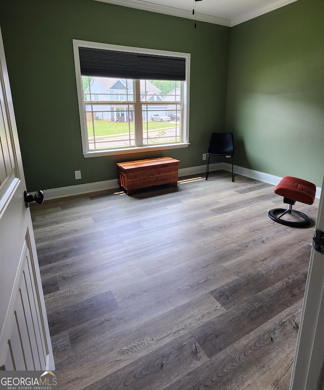556 Constitution Dr, Forsyth, GA 31029 - sitting room featuring crown molding, wood finished floors, and baseboards