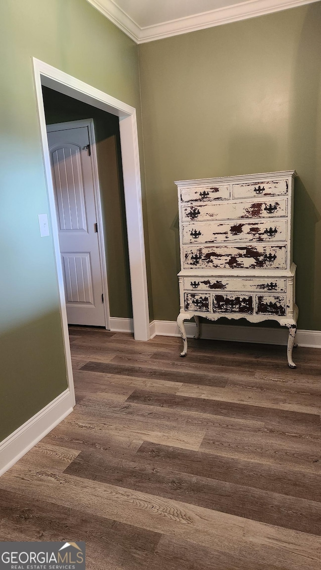 556 Constitution Dr, Forsyth, GA 31029 - empty room featuring crown molding, dark wood-style flooring, and baseboards